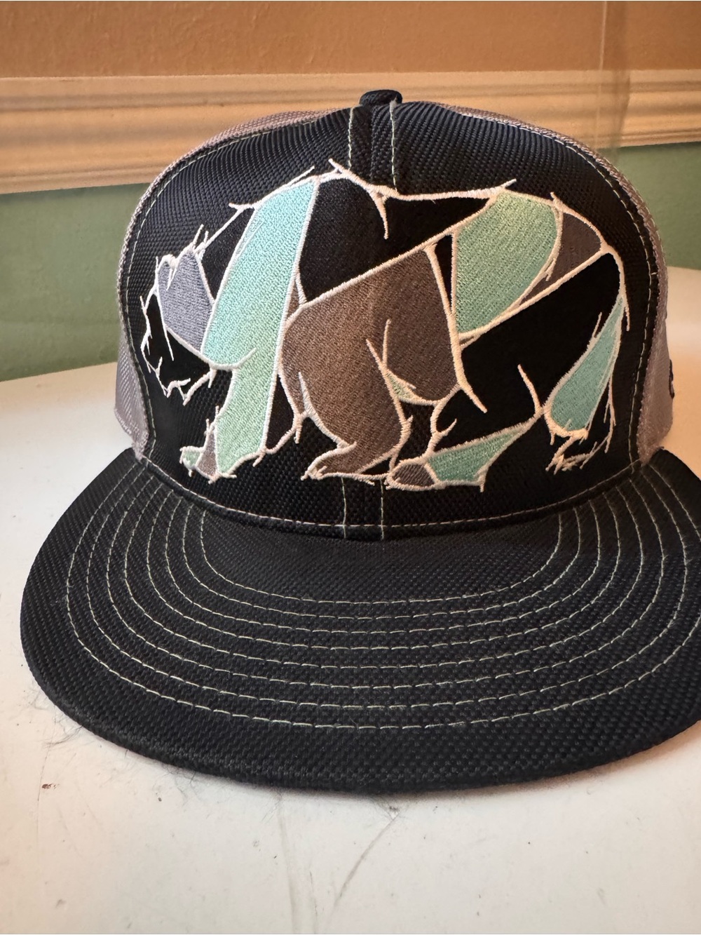 Flat bill strap back lid with Mint & Gray Bear Patch